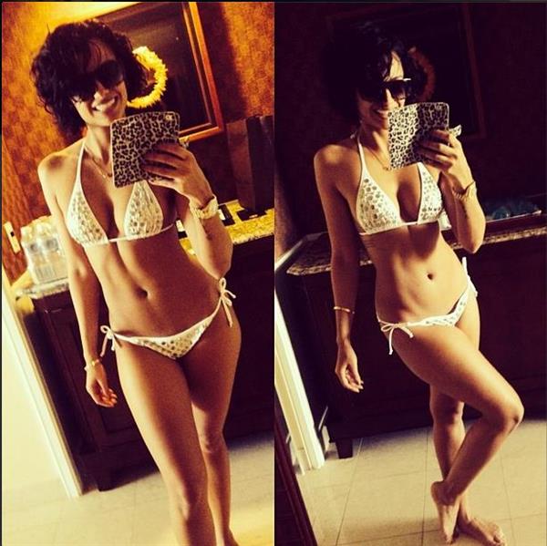 Nazanin Mandi in a bikini taking a selfie