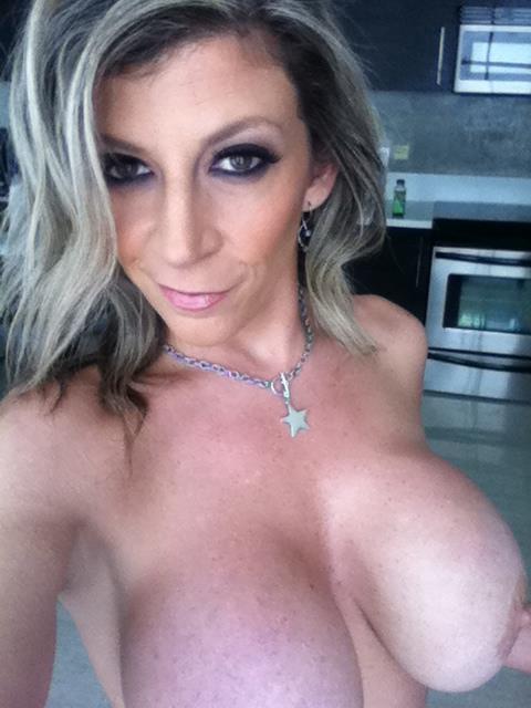Sara Jay taking a selfie and - breasts