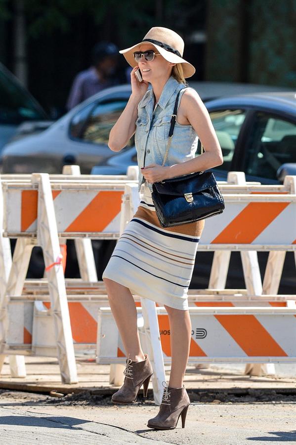 Diane Kruger - Wears a denim vest with a skirt as she chats on her cellphone while out the Bowery on September 12, 2012