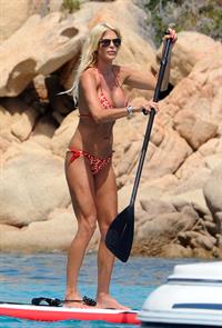 Victoria Silvstedt wearing a bikini on a board in Sardinia on August 8, 2012