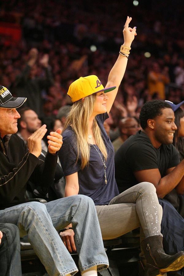 Kaley Cuoco attending a Los Angeles Lakers vs New York Knicks basketball game in LA on December 29, 2011