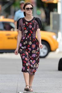 Keira Knightley wears a dark floral dress while strolling in New York City on August 7, 2012