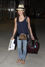 Kristin Kreuk - Pearson International Airport arrival candids in Toronto (July 16, 2012)