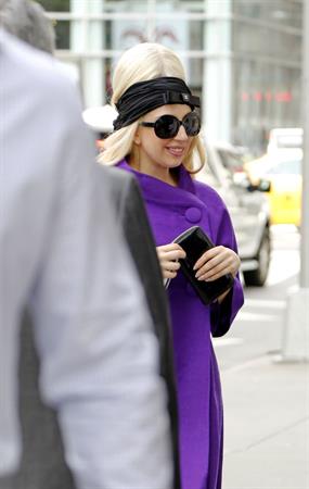 Lady Gaga holds her latest Vogue magazine cover September 2012 Issue close to her chest while out in New York City to visit a friend (07 August 2012).
