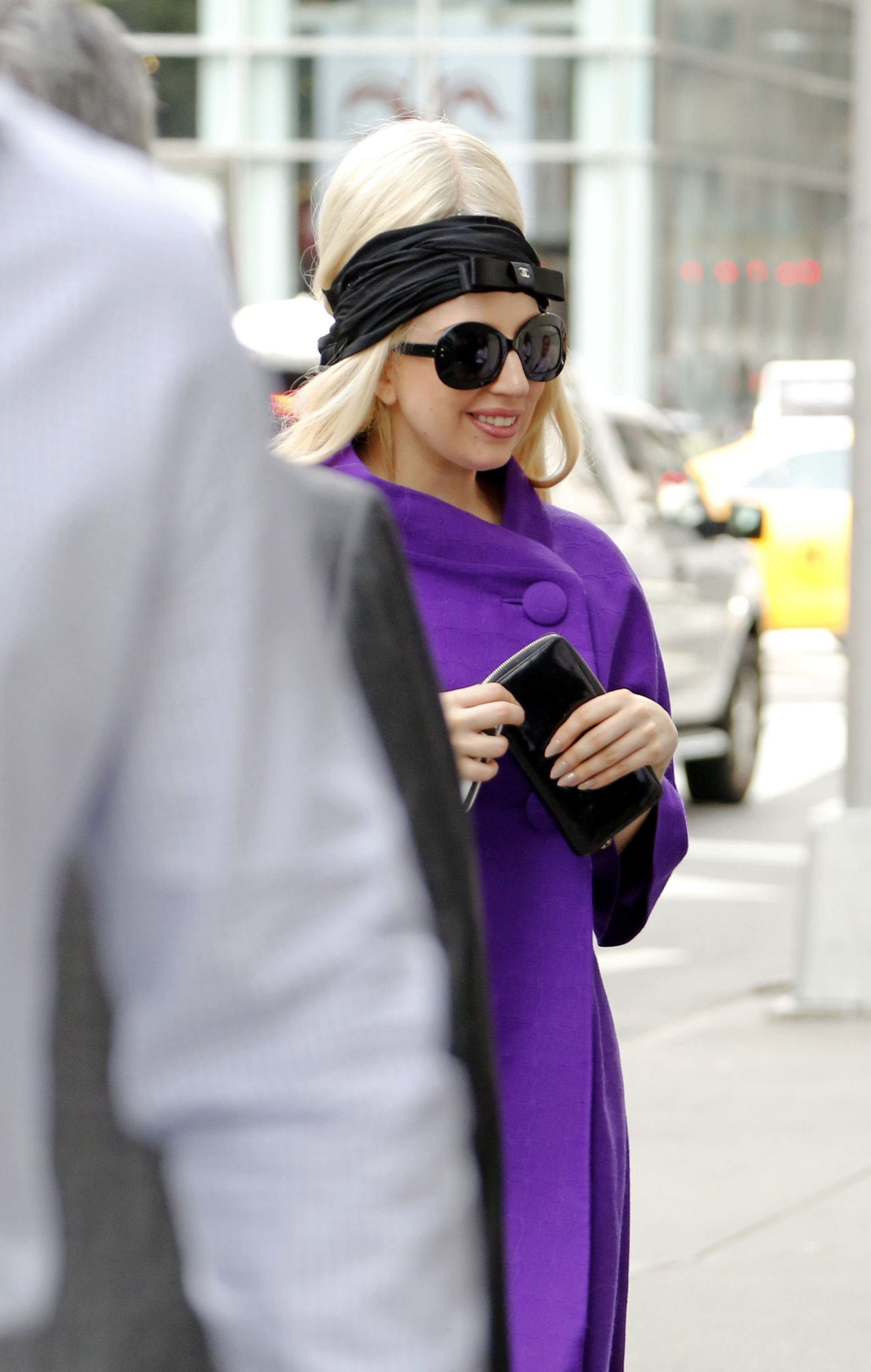 Lady Gaga holds her latest Vogue magazine cover September 2012 Issue close to her chest while out in New York City to visit a friend (07 August 2012).