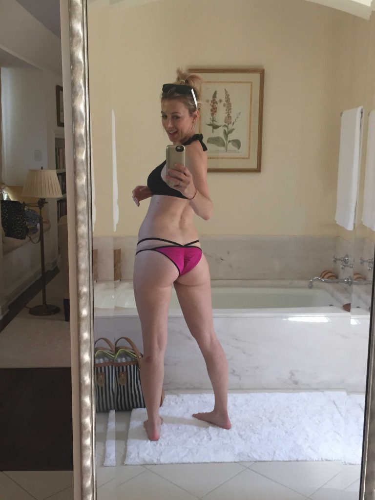 Iliza Shlesinger in a bikini taking a selfie and - ass. 