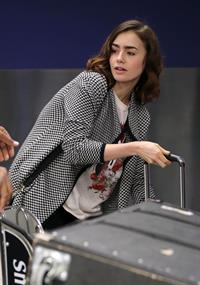 Lily Collins - LAX Airport 8/27/13