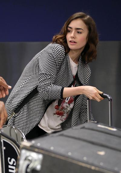 Lily Collins - LAX Airport 8/27/13