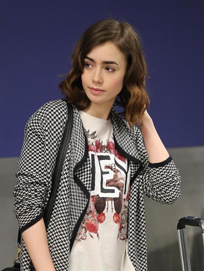 Lily Collins - LAX Airport 8/27/13