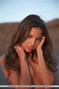 Altea B in  Edana  displays her slender, naked body as she poses sensually by the beach.