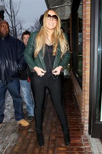 Mariah Carey made another stop at the Louis Vuitton store to shop with a family member. December 24, 2012 