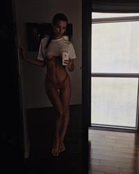 Emily Ratajkowski taking a selfie