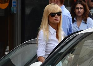 Michelle Hunziker Leaving her house in a white dress in Milan Italy on May 9, 2013