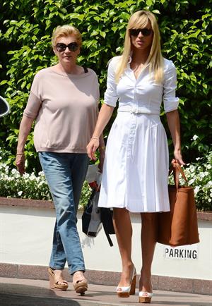 Michelle Hunziker Leaving her house in a white dress in Milan Italy on May 9, 2013