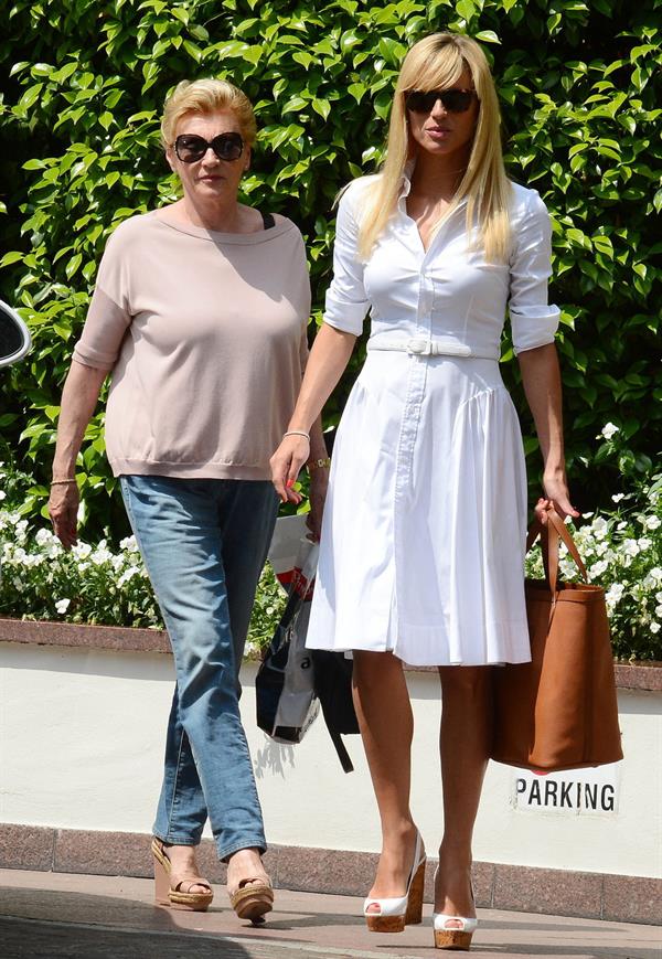 Michelle Hunziker Leaving her house in a white dress in Milan Italy on May 9, 2013