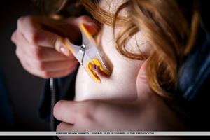 Kerry Topless Pictures Kerry uses clothespin as she plays with her nipples and pussy.