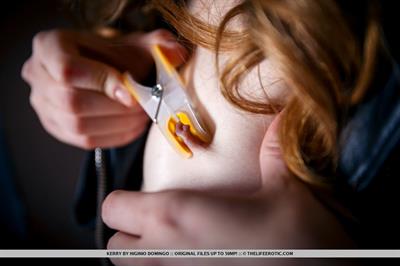 Kerry uses clothespin as she plays with her nipples and pussy.