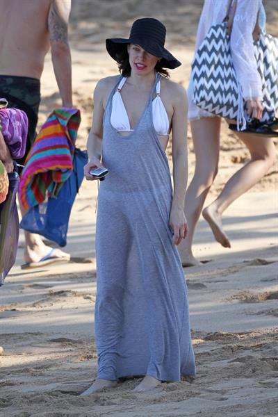 Milla Jovovich on the beach in a bikini on New Years Eve in Maui, Hawaii December 31, 2012 