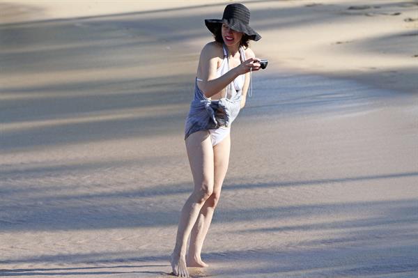 Milla Jovovich on the beach in a bikini on New Years Eve in Maui, Hawaii December 31, 2012 