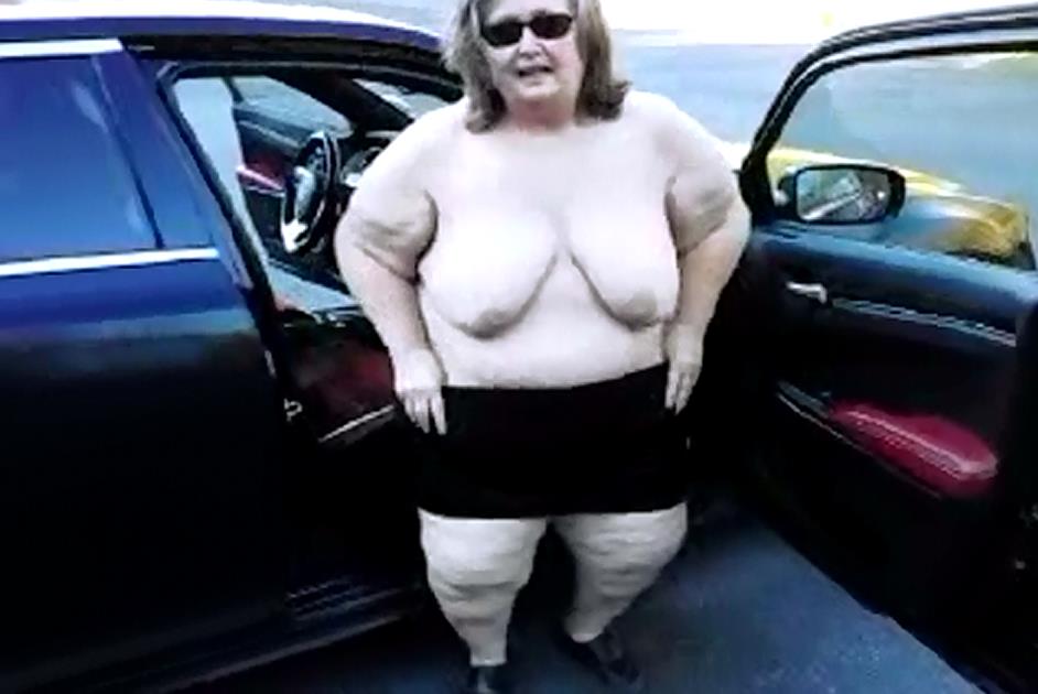 Wearing a miniskirt and showing my big 48DD tits outdoors in public