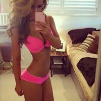 Ellie Gonsalves in a bikini taking a selfie