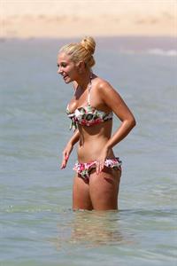 Tulisa Contostavlos in a bikini on the beach in Honolulu July 31, 2012