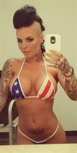 Christy Mack in a bikini taking a selfie and - ass
