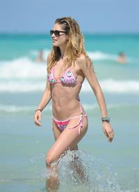 Doutzen Kroes enjoys a day on the beach in Miami Beach, FL on April 28, 2013