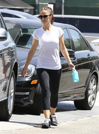 Minka Kelly leaving the gym in West Hollywood wearing a white shirt and black pants