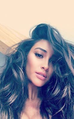Shay Mitchell taking a selfie