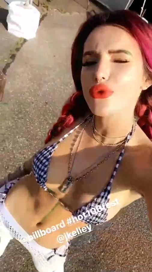 Bella Thorne in a bikini taking a selfie