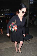 Dita Von Teese arrives from a flight at LAX August 20, 2014