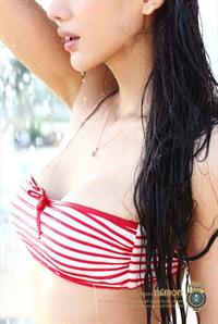 Jin Mei Xin in a bikini taking a selfie