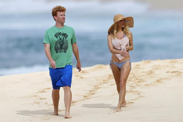 Pamela Anderson Takes a walk in bikini bottoms on the Island of Maui December 30, 2012 