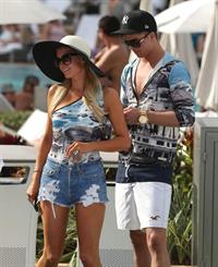 Paris Hilton spends the day in and out of the pool in Miami December 8, 2012