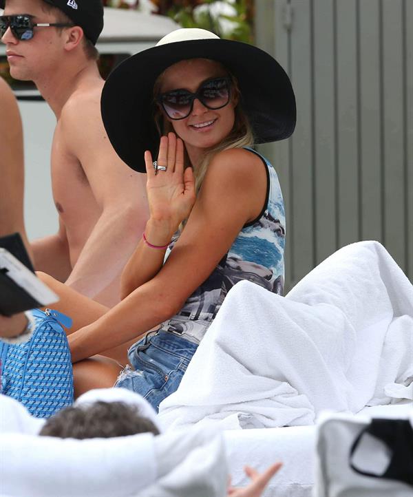 Paris Hilton spends the day in and out of the pool in Miami December 8, 2012