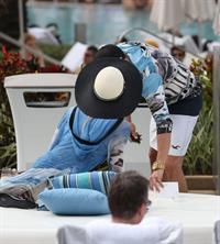 Paris Hilton spends the day in and out of the pool in Miami December 8, 2012