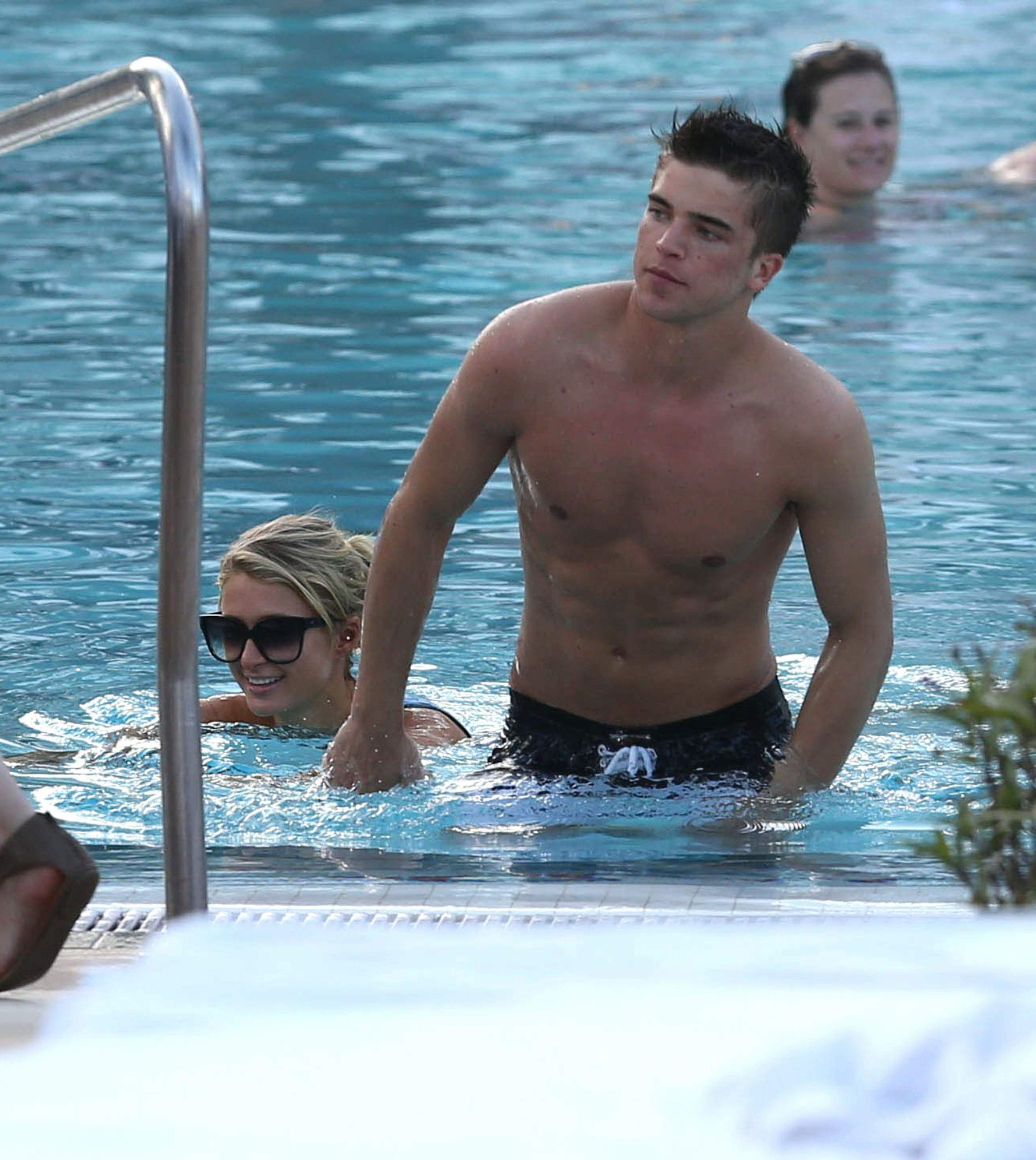 Paris Hilton spends the day in and out of the pool in Miami December 8, 2012