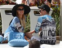 Paris Hilton spends the day in and out of the pool in Miami December 8, 2012