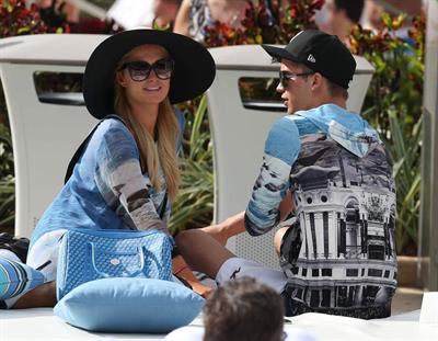 Paris Hilton spends the day in and out of the pool in Miami December 8, 2012