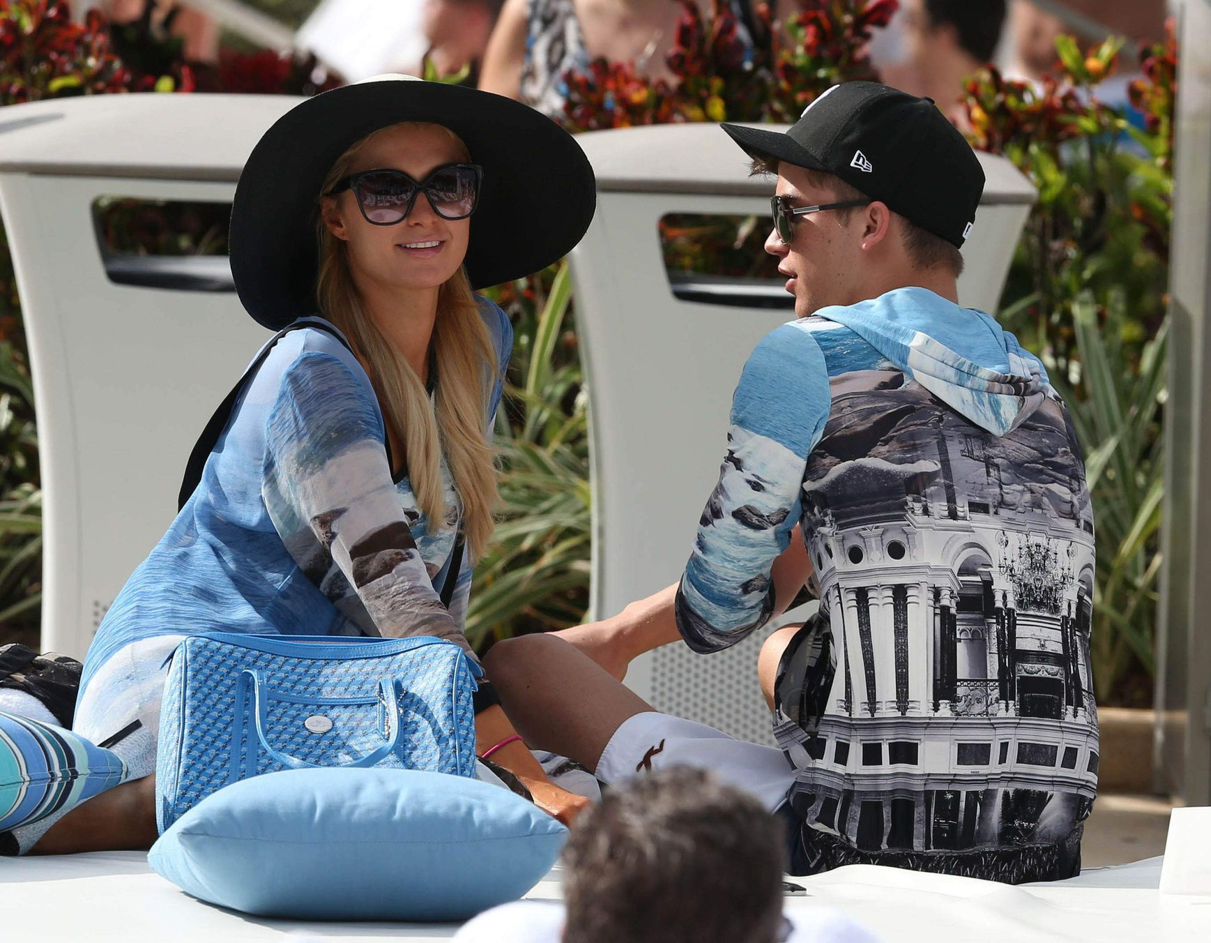 Paris Hilton spends the day in and out of the pool in Miami December 8, 2012