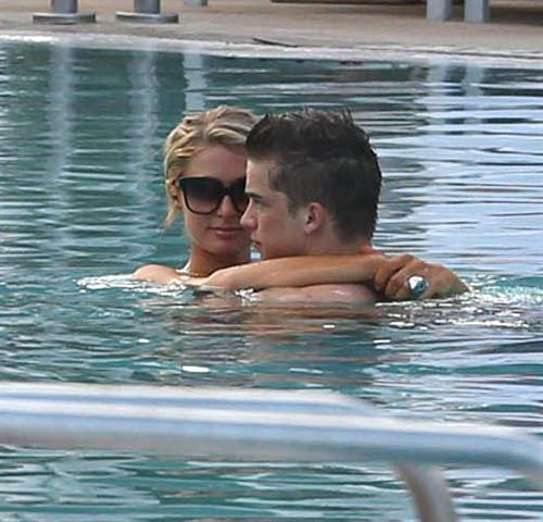 Paris Hilton spends the day in and out of the pool in Miami December 8, 2012