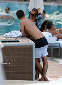 Paris Hilton spends the day in and out of the pool in Miami December 8, 2012
