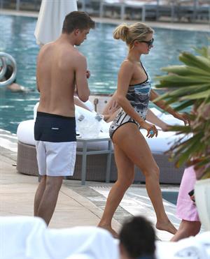 Paris Hilton spends the day in and out of the pool in Miami December 8, 2012