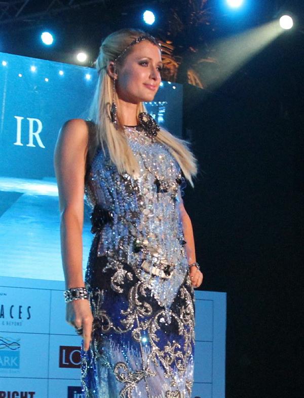 Paris Hilton walks for designer duo Shane and Falguni Peacock and performs as a DJ at the India Resort Fashion Week