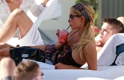 Paris Hilton poolside at their Miami hotel December 7-2012 