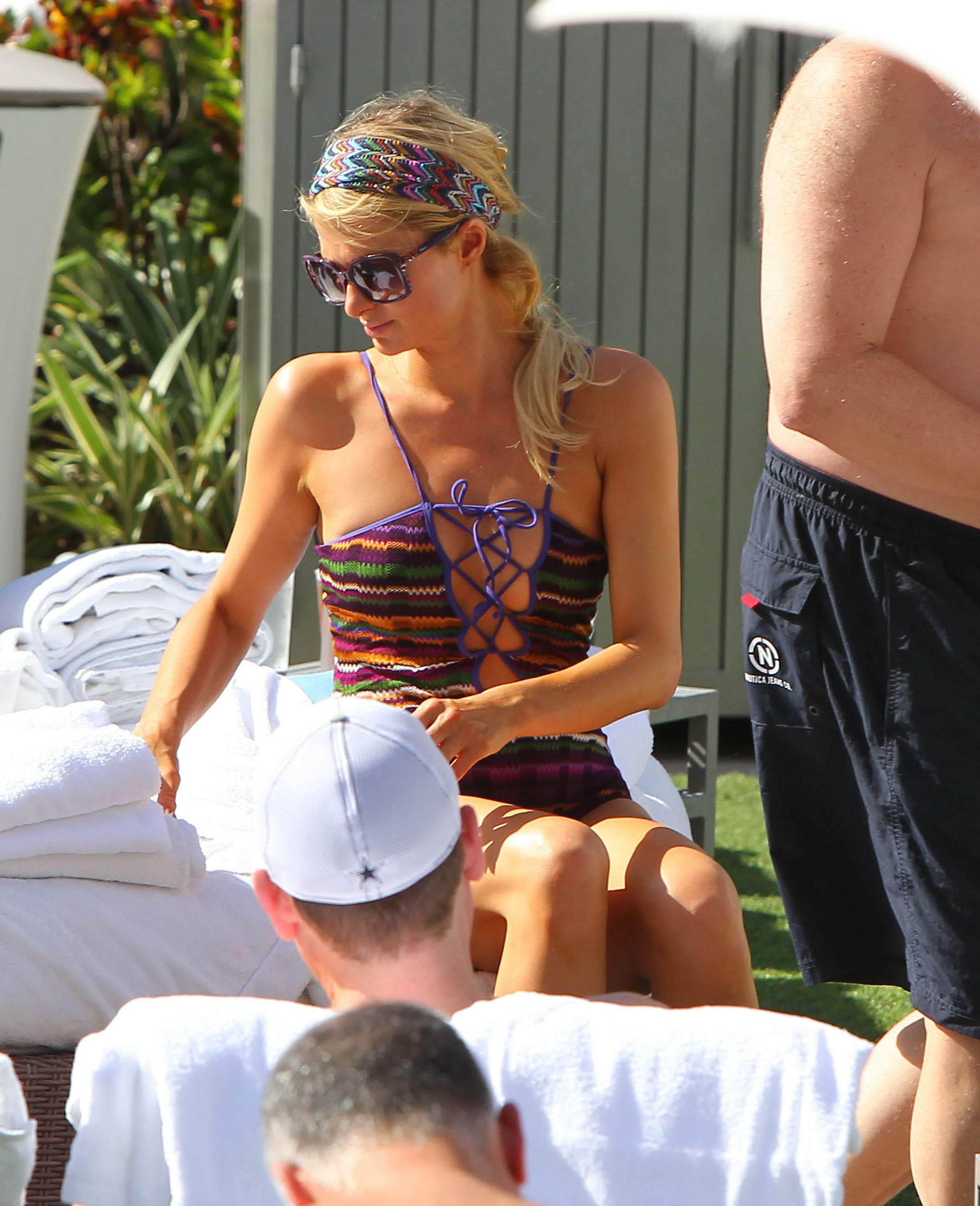Paris Hilton poolside at their Miami hotel December 7-2012 