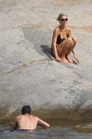 Paris Hilton - Wearing a swimsuit at a beach in France August 6, 2012