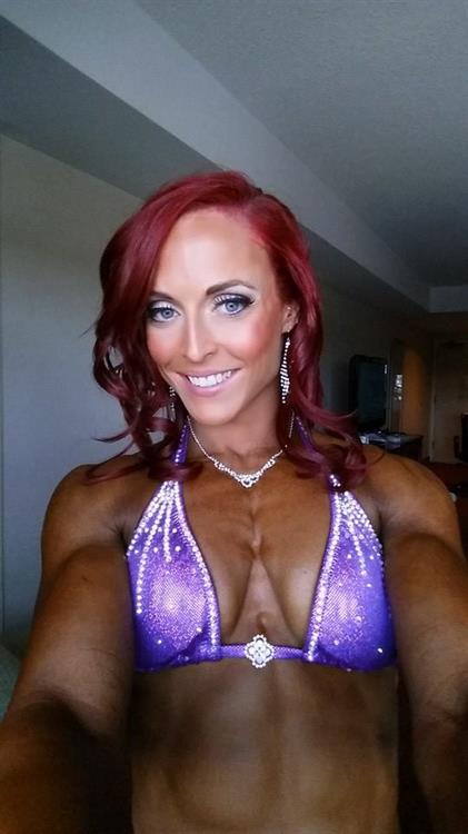 Katie M. Lee in a bikini taking a selfie