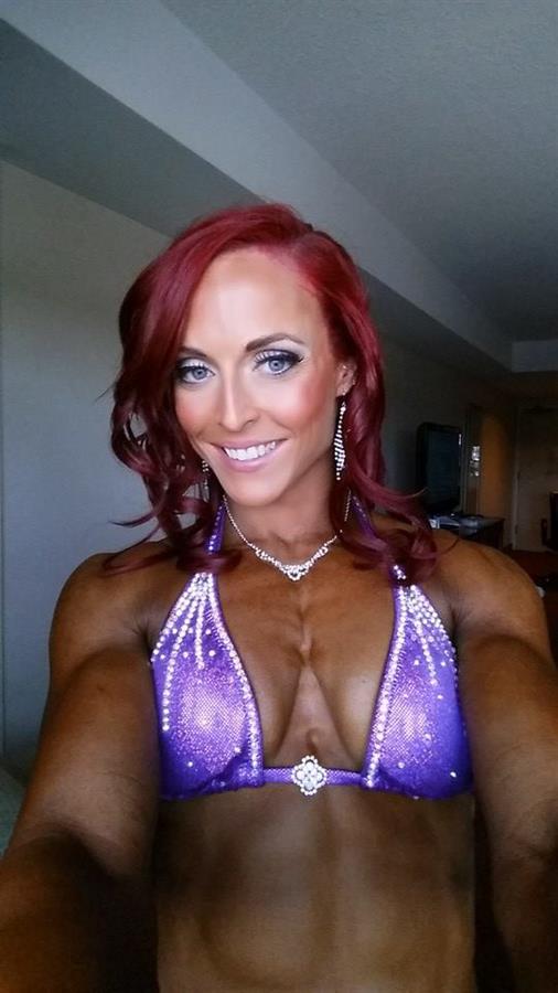 Katie M. Lee in a bikini taking a selfie